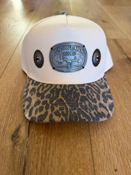 A Concho NFR belt buckle trucker hat
