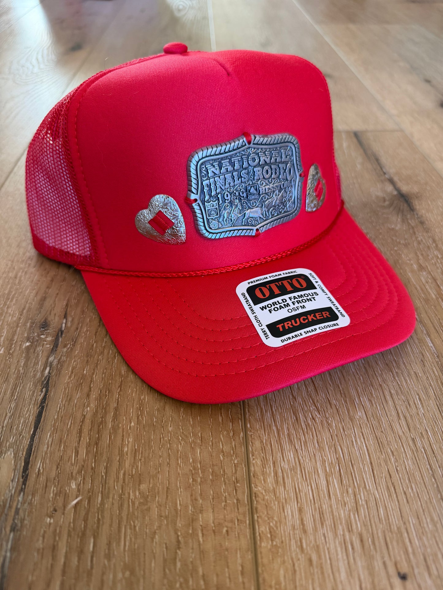 A Concho NFR belt buckle trucker hat
